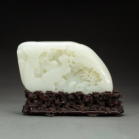 A CARVED WHITE JADE BOULDER