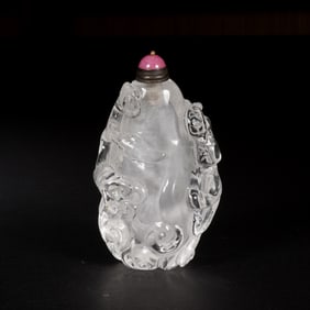A CARVED ROCK CRYSTAL