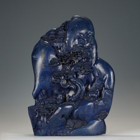 A CARVED LAPIS DECORATION