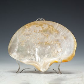 A CARVED MOTHER OF PEARL