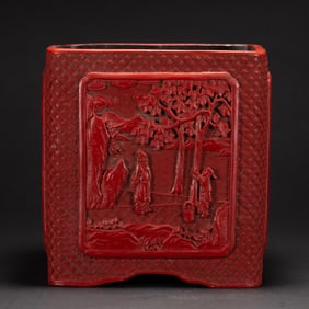 A CARVED CINNABAR FIGURAL STORY LACQUER BRUSHPOT