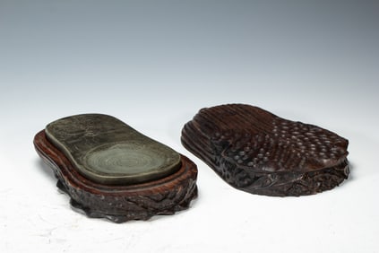 A CARVED INKSTONE WITH BOX