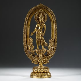 A BRONZE-GILT STANDING PADMAPANI