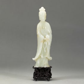 A CARVED WHITE JADE GUANYIN