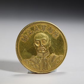 A SILVER-GILT COIN