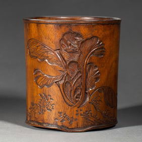 A CARVED HUANGHUALI BRUSHPOT