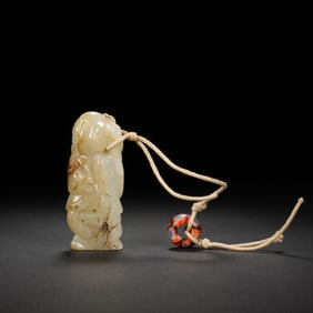A CARVED WHITE JADE BOY