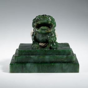 A FINE CARVED SPINACH GREEN JADE LION SEAL