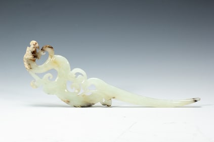A CARVED WHITE JADE HAIRPIN