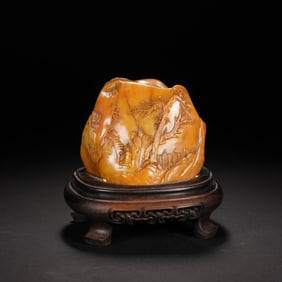 A CARVED TIANHUANG BOULDER
