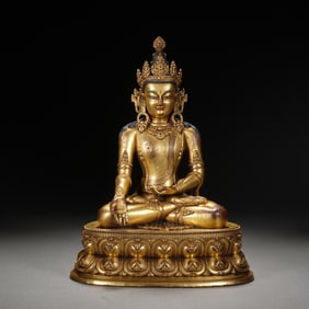 A BRONZE-GILT SEATED BUDDHA