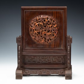 A CARVED HUANGHULI TABLE SCREEN