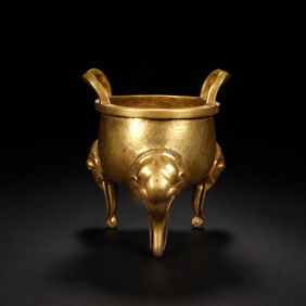 A BRONZE-GILT TRIPOD CENSER