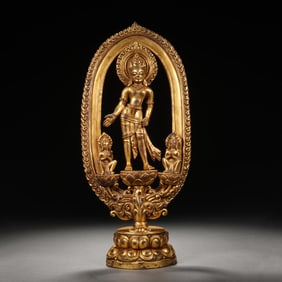 A BRONZE-GILT STANDING PADMAPANI