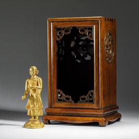 A BRONZE-GILT FIGURE OF ARHAT