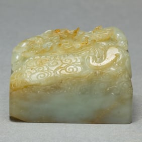 A CARVED WHITE JADE DRAGON SEAL