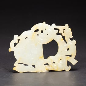 A CARVED WHITE JADE PLAQUE SHE
