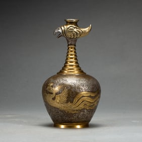A BRONZE PARTLY GILT PHOENIX EWER