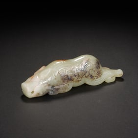 A CARVED JADE MYTHICAL BEAST