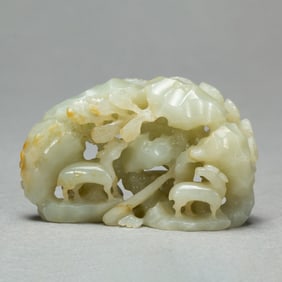 A CARVED WHITE JADE DECORATION
