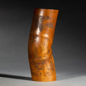 A CARVED BAMBOO ARM-REST