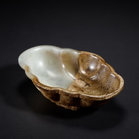A CARVED WHITE JADE LOBED WASHER
