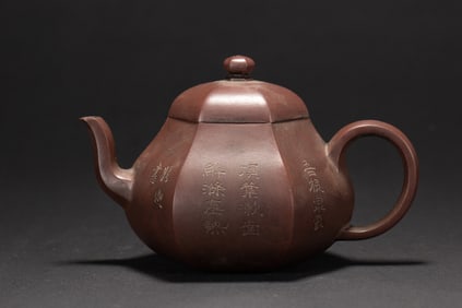 A CHINESE INSCRIBED YIXING GLAZE ZISHA TEAPOT