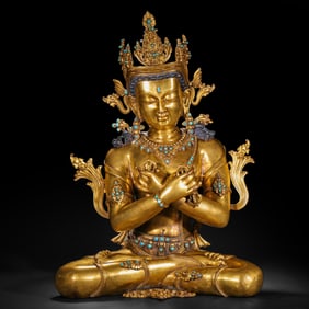 An extremely rare BRONZE-GILT VAJRADHARA