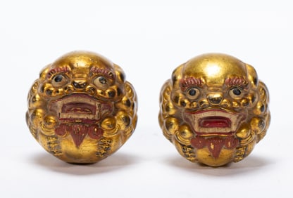 PAIR PAINTED LACQUER BRONZE BEAST BALLS