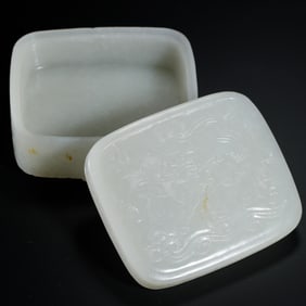 A CARVED WHITE JADE BOX WITH COVER