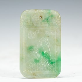A CARVED JADEITE PLAQUE