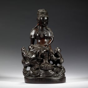 A CARVED ROSEWOOD ZITAN GUANYIN