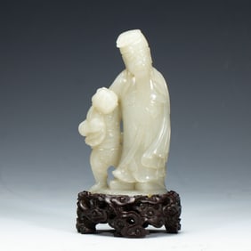 A CARVED WHITE JADE IMMORTAL LVDONGBIN