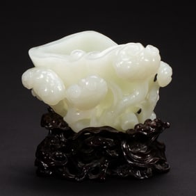 A FINE CARVED WHITE JADE LINGZHI WASHER