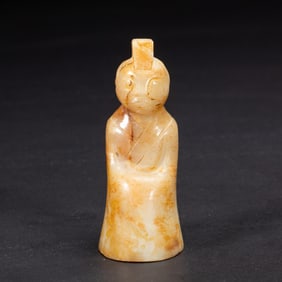 A CARVED JADE FIGURE