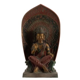 A VERY RARE POLYCHROME PAINTED CARVED STONE MAITREYA