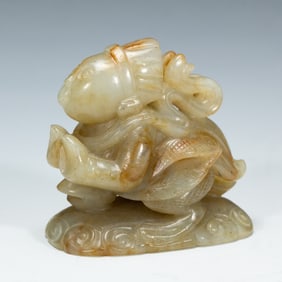 A CARVED WHITE JADE GARUDA HAT FINIAL