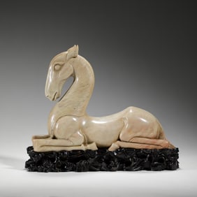 A CARVED SHOUSHAN STONE HORSE