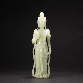 A FINE CARVED WHITE JADE STANDING BODHISATTVA