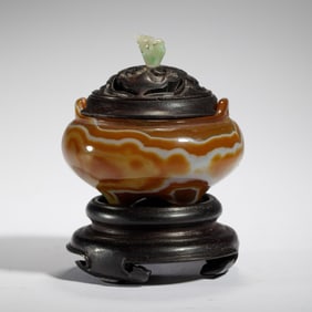 A CARVED AGATE TRIPOD CENSER
