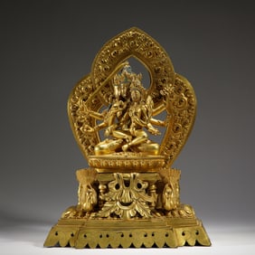 A TIBETAN BRONZE-GILT MANJUSRI