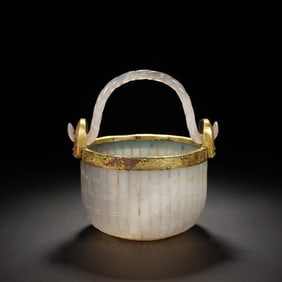 A CARVED ROCK CRYSTAL BASKET