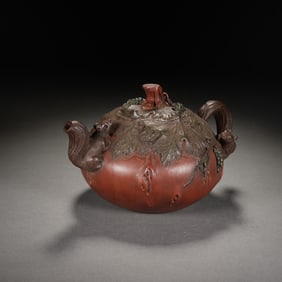 A YIXING GLAZE ZISHA TEAPOT