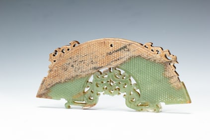 A CARVED JADE ARCH PENDANT HUANG