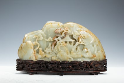 A CARVED WHITE JADE LANDSCAPE DECORATION