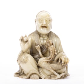 A CARVED SHOUSHAN STONE LUOHAN