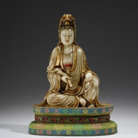 A CARVED JADE GUANYIN