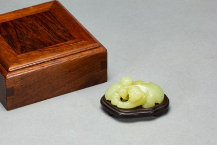 A CARVED YELLOW JADE BOYS GROUP
