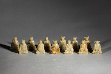 A RARE SET OF TWELVE CARVED JADE ZODIAC ANIMALS