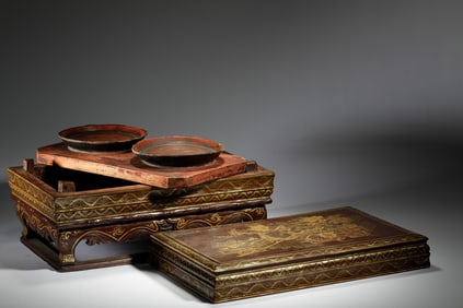 A LACQUER AND GILT COSMETIC BOX